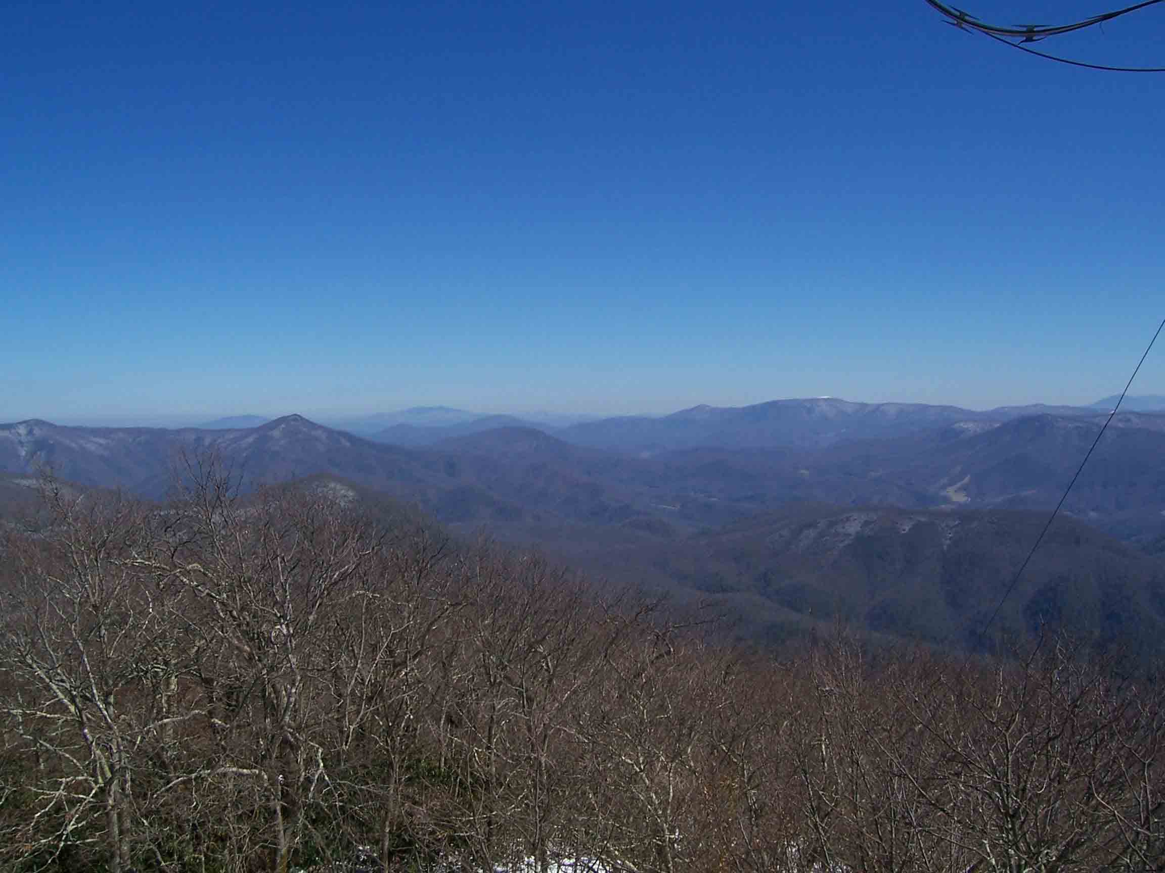 mm 14.1 - Taken from Camp Creek Bald, this pic shows the AT route over Big Butt, past Devils Fork Gap, over Big Bald, No Business Knob, Temple Hill, Unaka and Roan Highlands in the distance. Courtesy willey54@yahoo.com